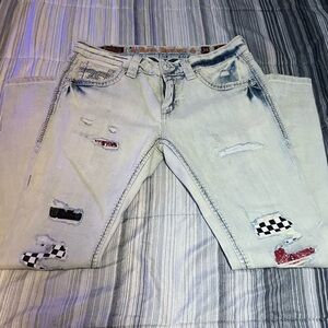 Rock Revival Light Blue Jeans with Red and Black Patches